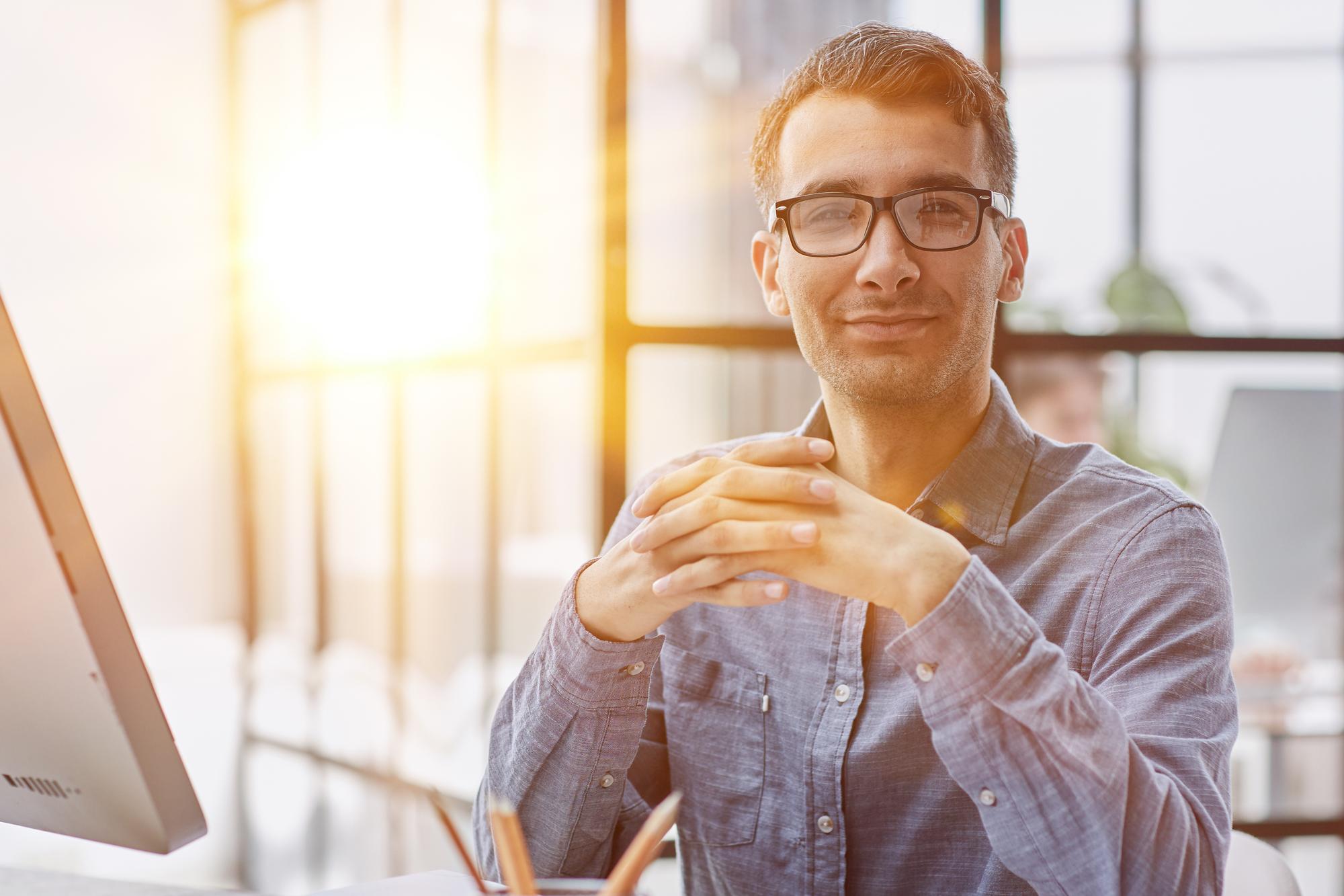 Founder portrait in workspace, warm lighting